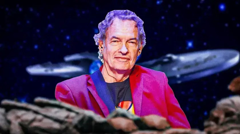 Actor Gary Graham with Star Trek Enterprise behind him.
