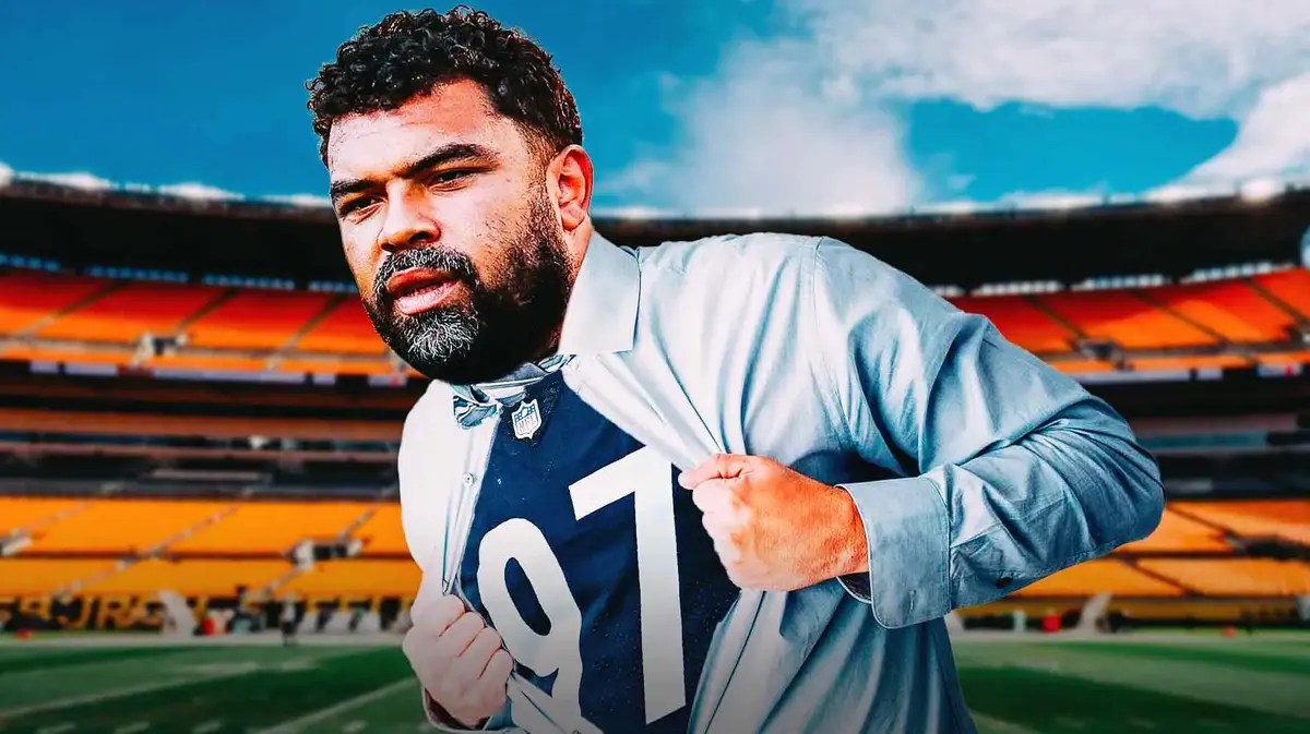 Steelers Cam Heyward opens his shirt to reveal a Steelers jersey