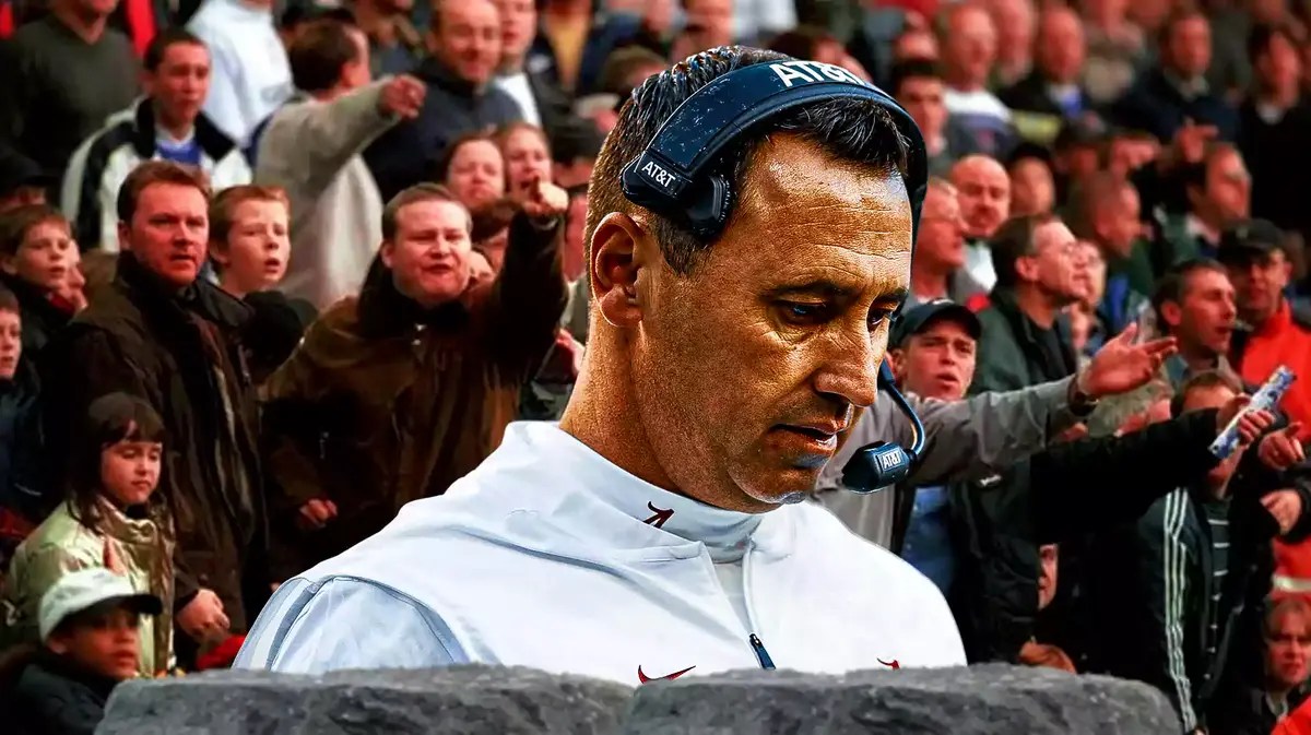Texas football head coach Steve Sarkisian with angry crowd at the back
