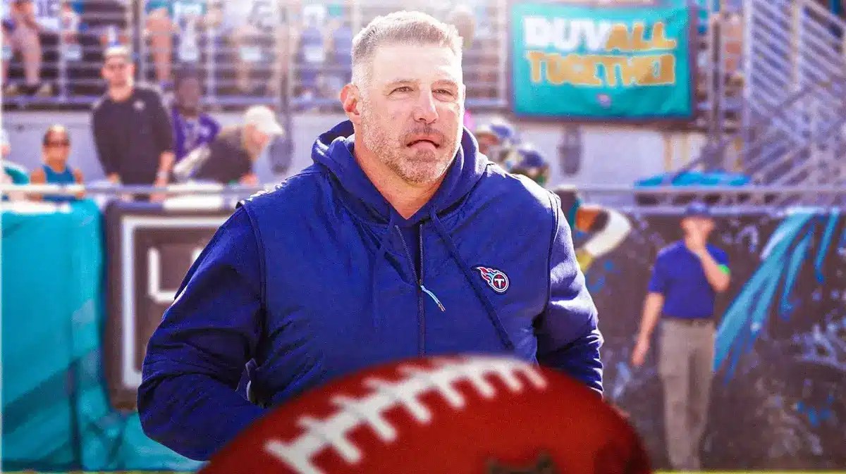 Titans HC Mike Vrabel looking sad and Titans stadium un background