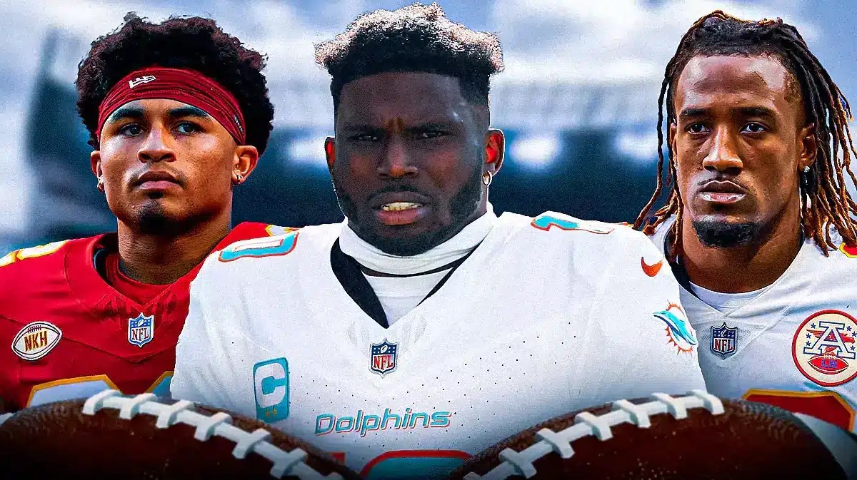 Tyreek Hill between Trent McDuffie and L'Jarius Sneed