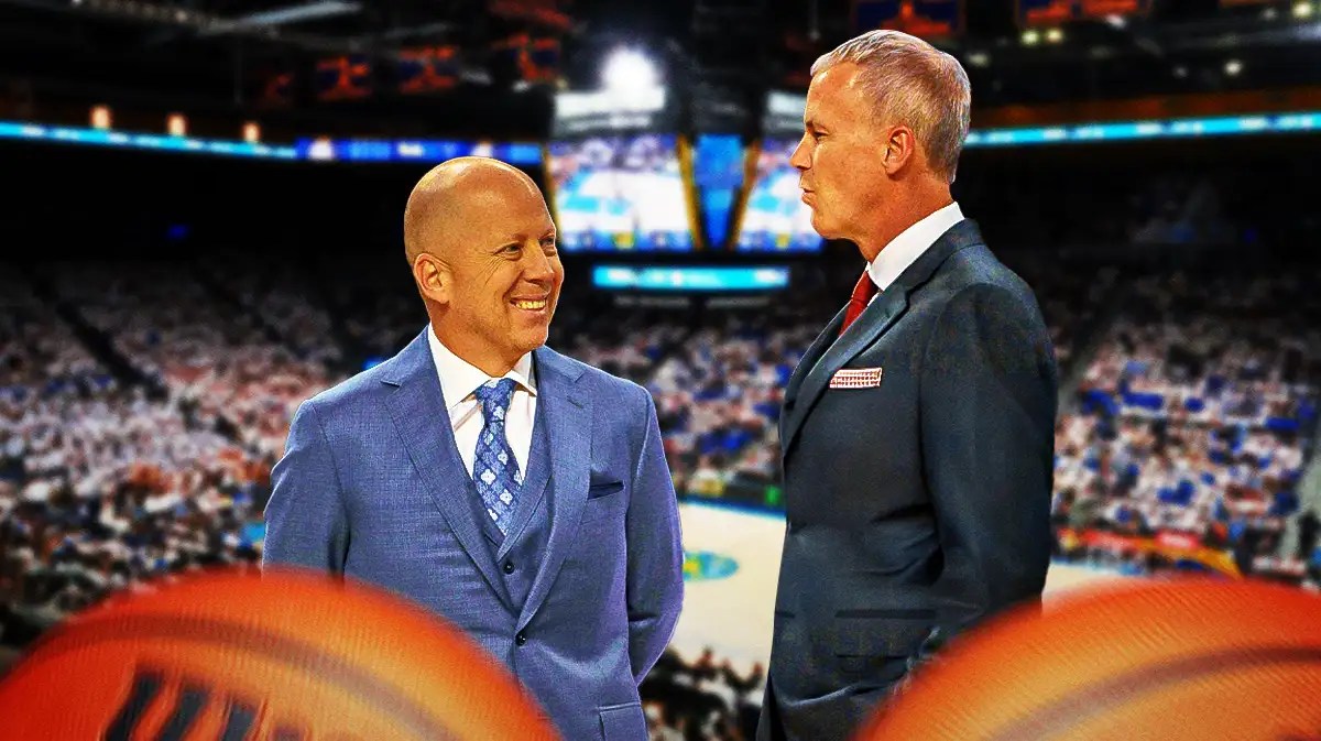 UCLA basketball coach Mick Cronin smiling at USC coach Andy Enfield.