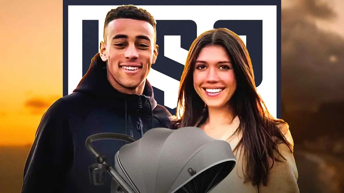 Tyler Adams and Sarah Schmidt with a baby stroller in front of them, the USMNT logo behind them