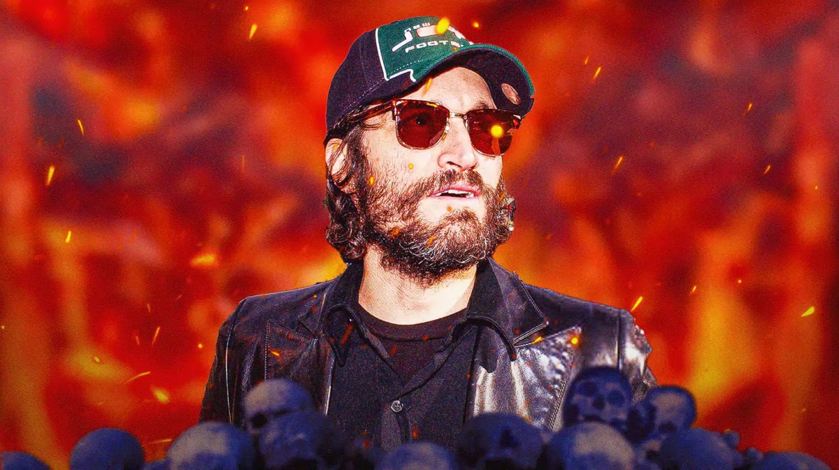 Vincent Gallo in sunglasses and brimstone behind him.