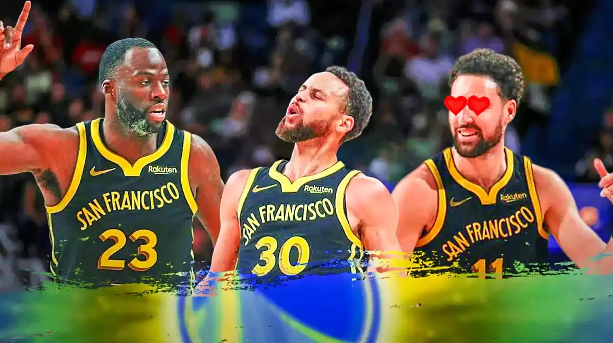 Klay Thompson with heart eyes looking at Stephen Curry and Draymond Green