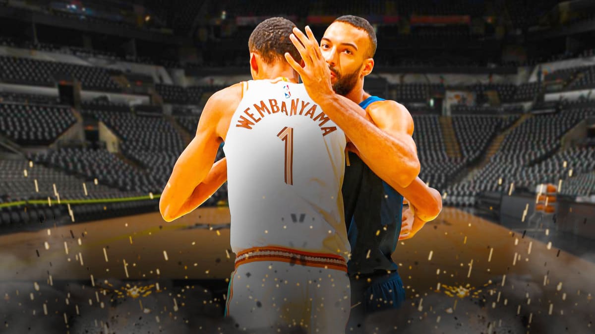 Spurs rookie Victor Wembanyama and Rudy Gobert hugging each other