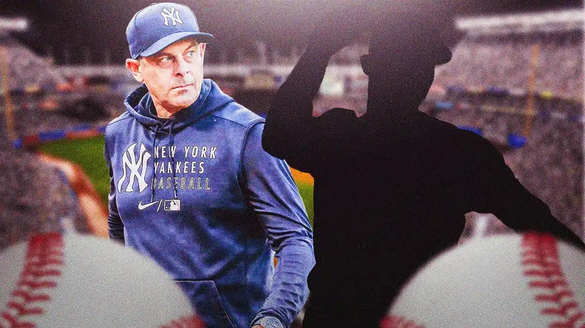 Yankees' Aaron Boone looking at the silhouette of a pitcher