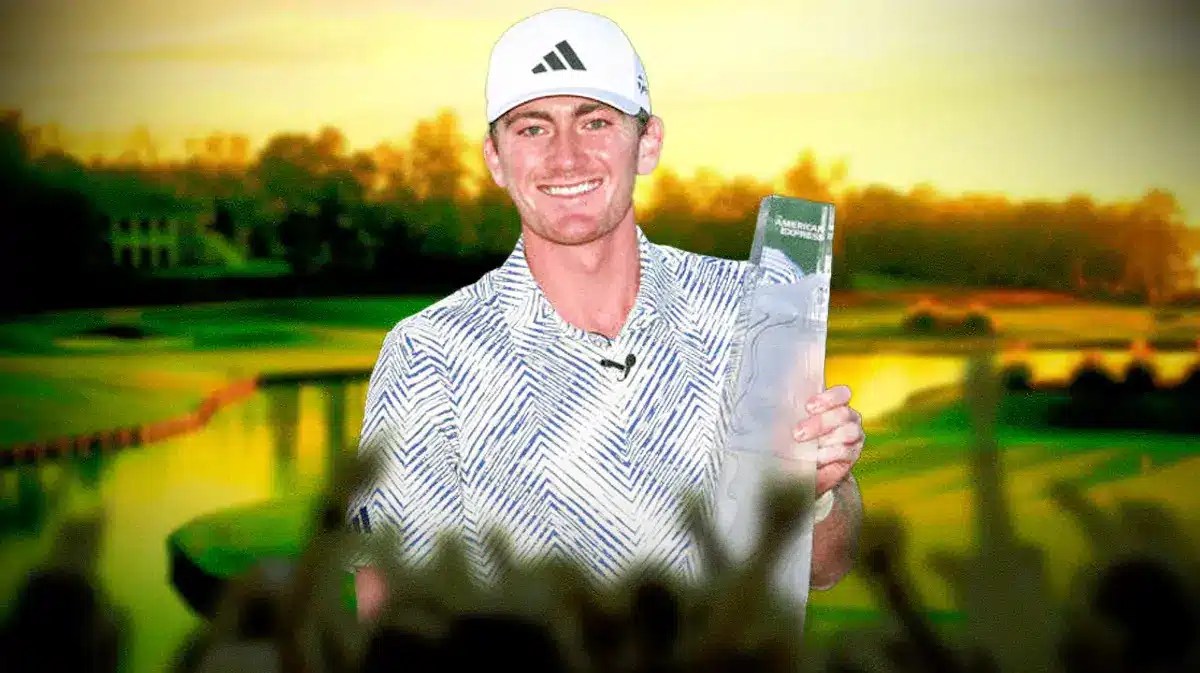 Nick Dunlap holding the American Express trophy and smiling.