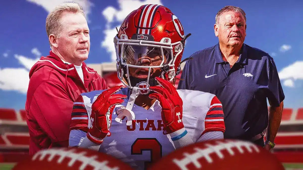 New Arkansas running back Ja'Quinden Jackson, flanked by coaches Bobby Petrino and Sam Pittman