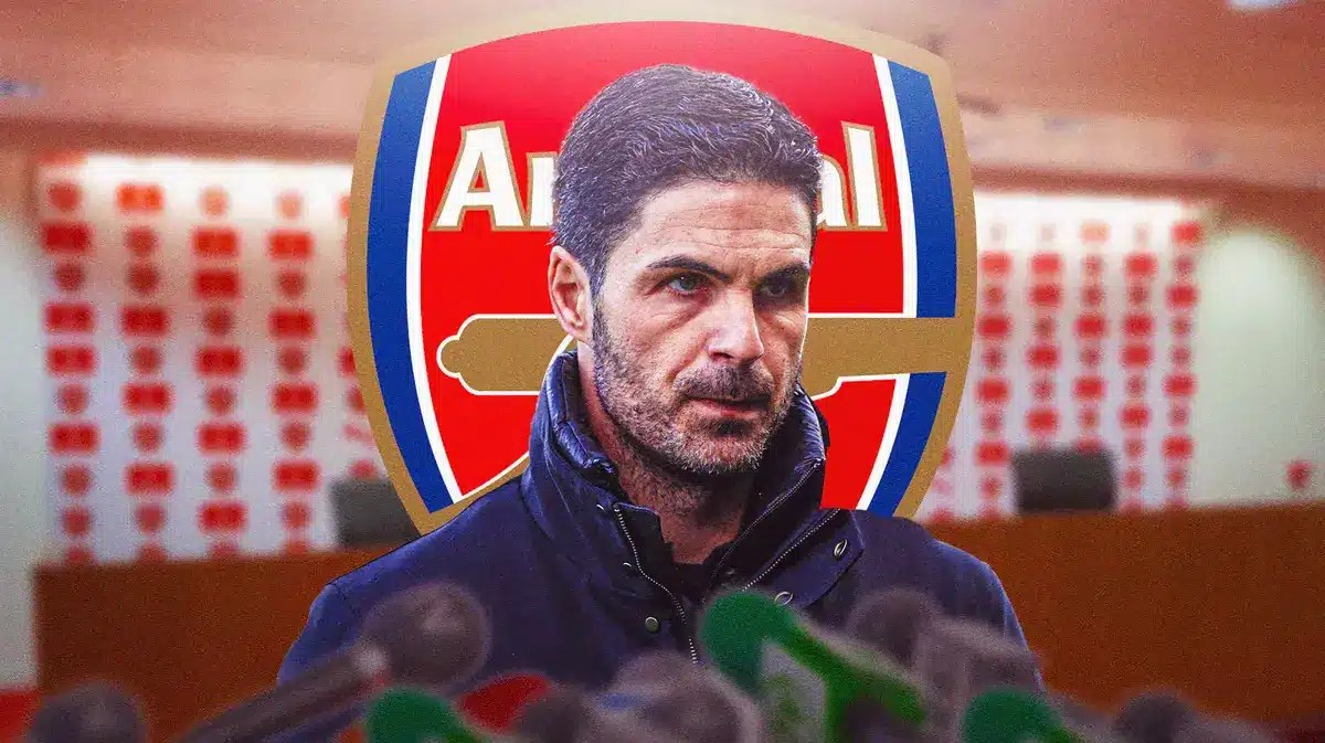 Mikel Arteta talking to the press in front of the Arsenal logo