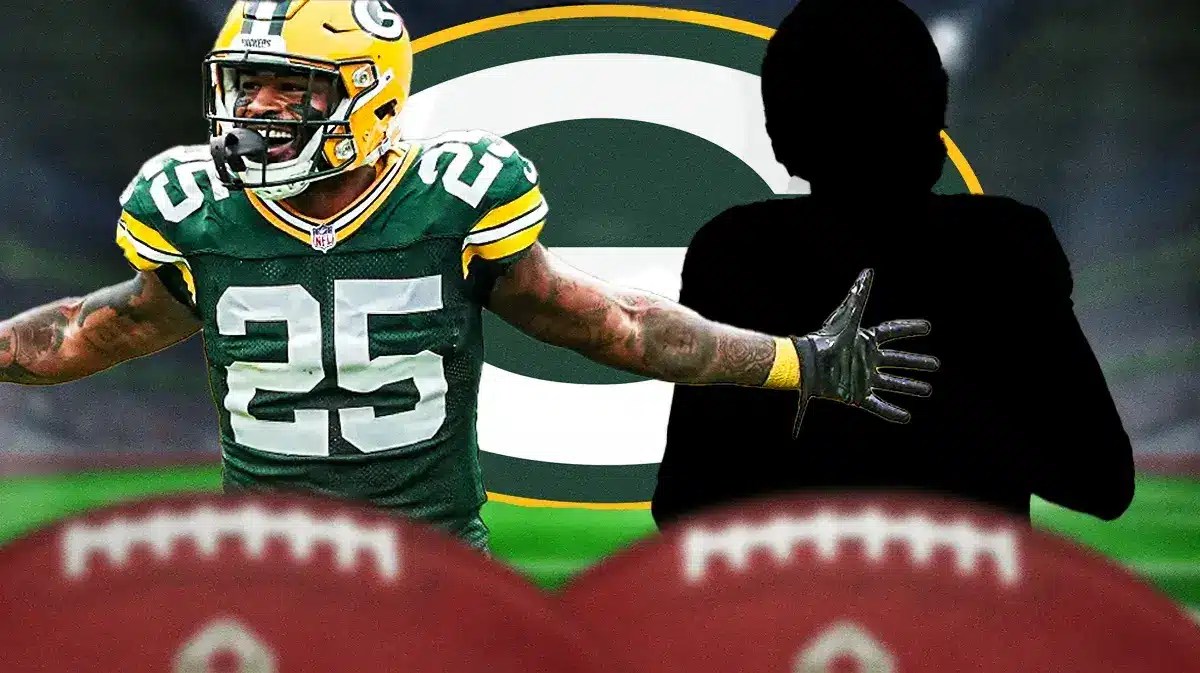 Keisean Nixon in middle of image looking happy, one silhouetted GB Packers player on each side, GB Packers logo, football field in background