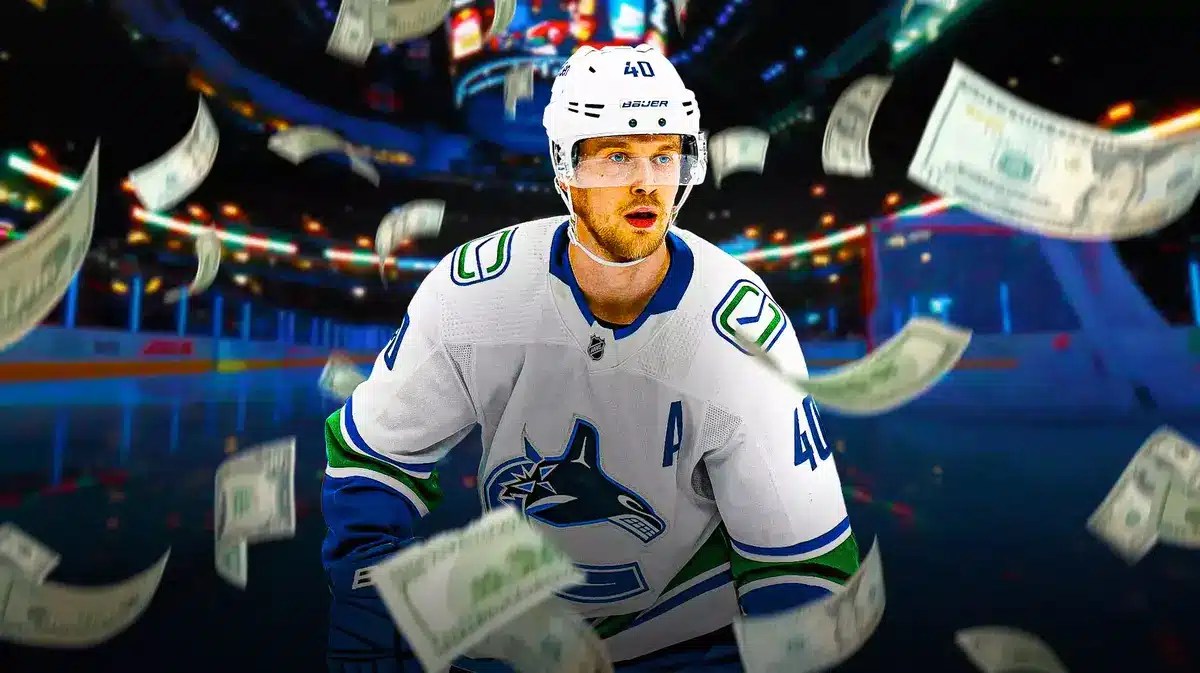 Canucks star Elias Pettersson with money raining down around him.