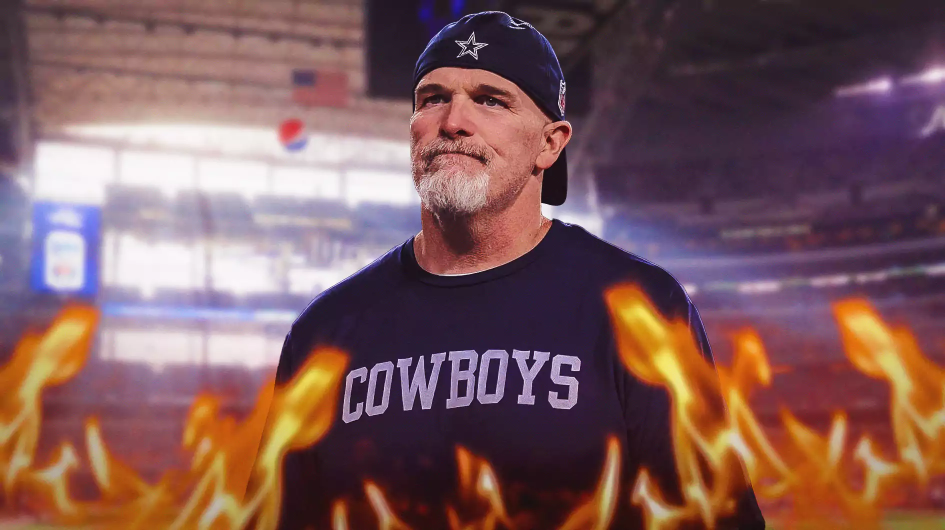 Dallas Cowboys defensive coordinator Dan Quinn with flames around him.