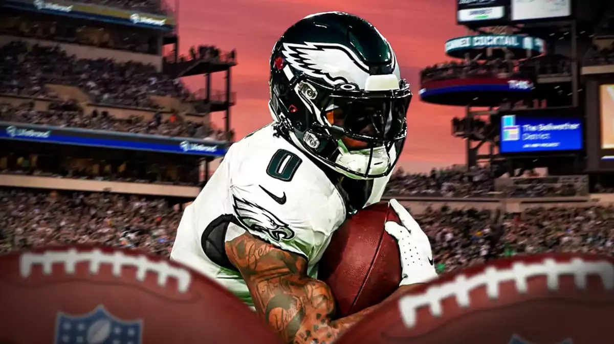 Eagles RB D'Andre Swift carrying the football with a stadium in the background.