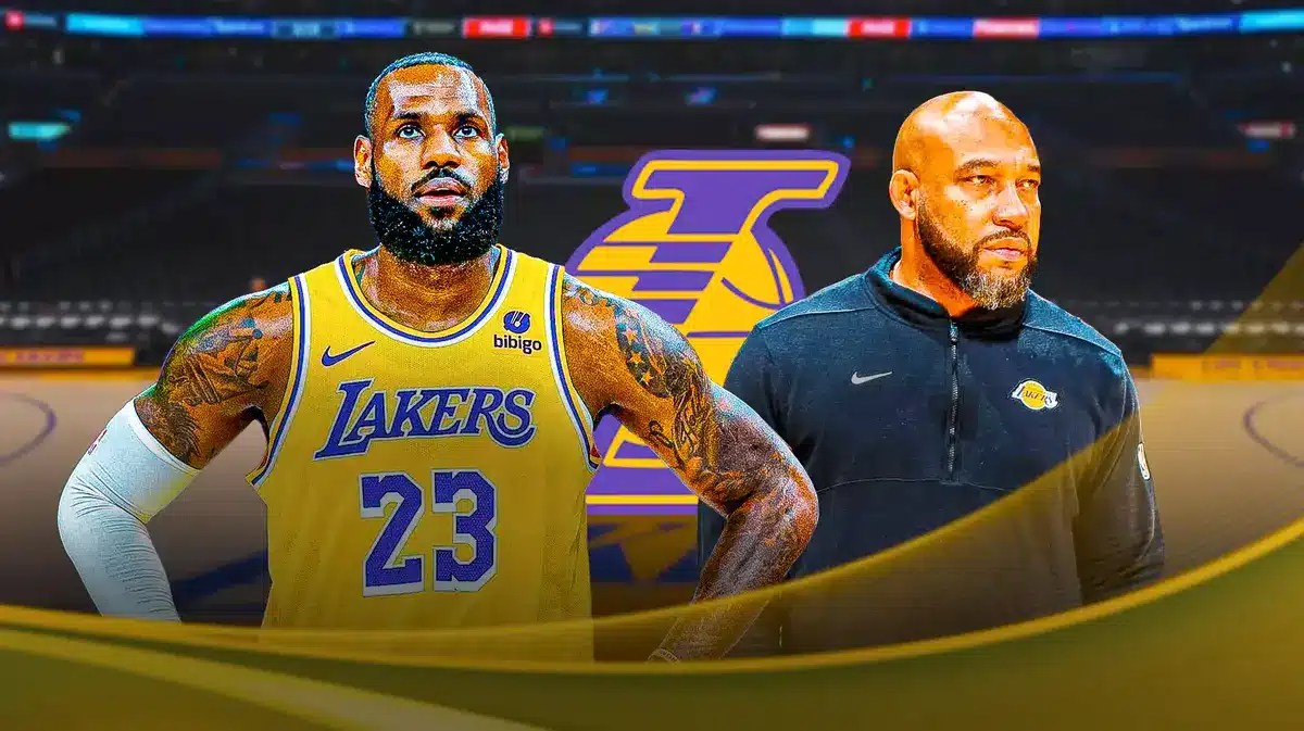 Photo: LeBron James and Darvin Ham in Lakers gear, with Lakers logo behind them