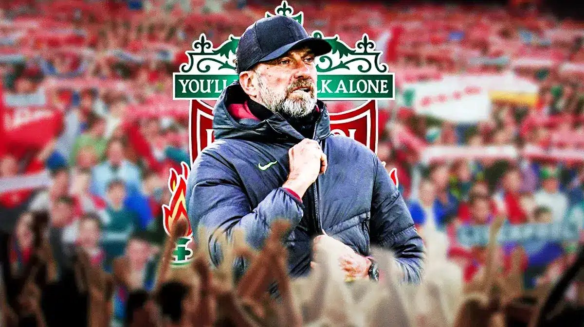 Jurgen Klopp in front of the Liverpool logo, fans around him