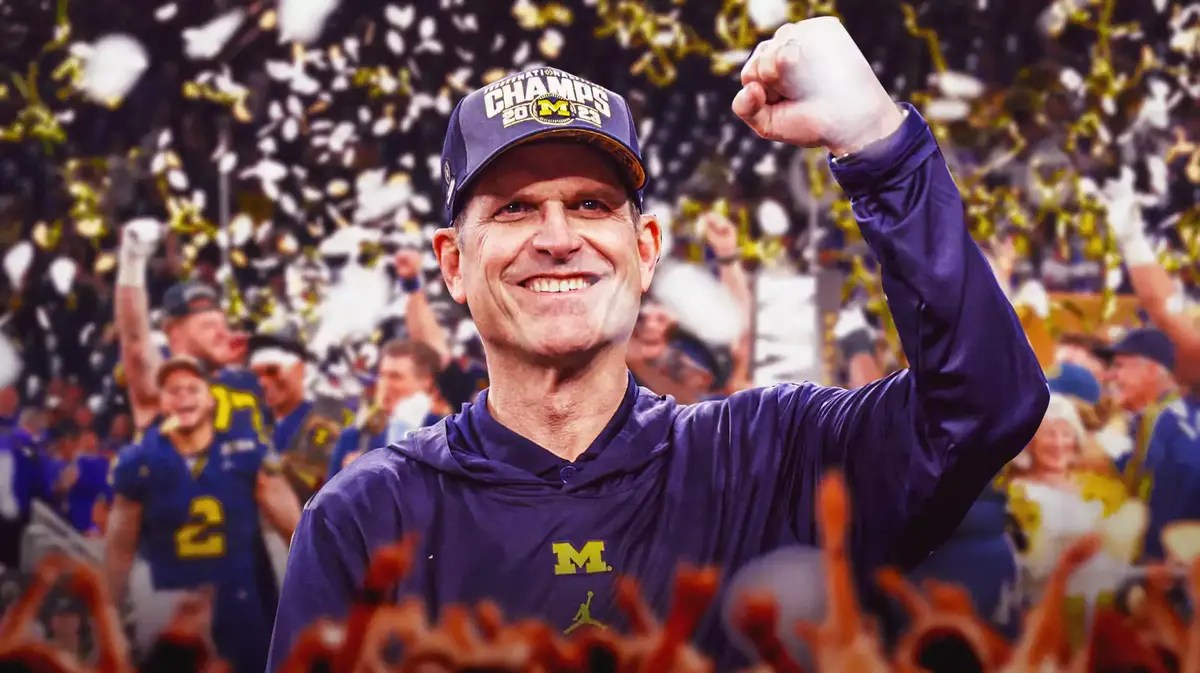 Michigan football head coach Jim Harbaugh celebrating