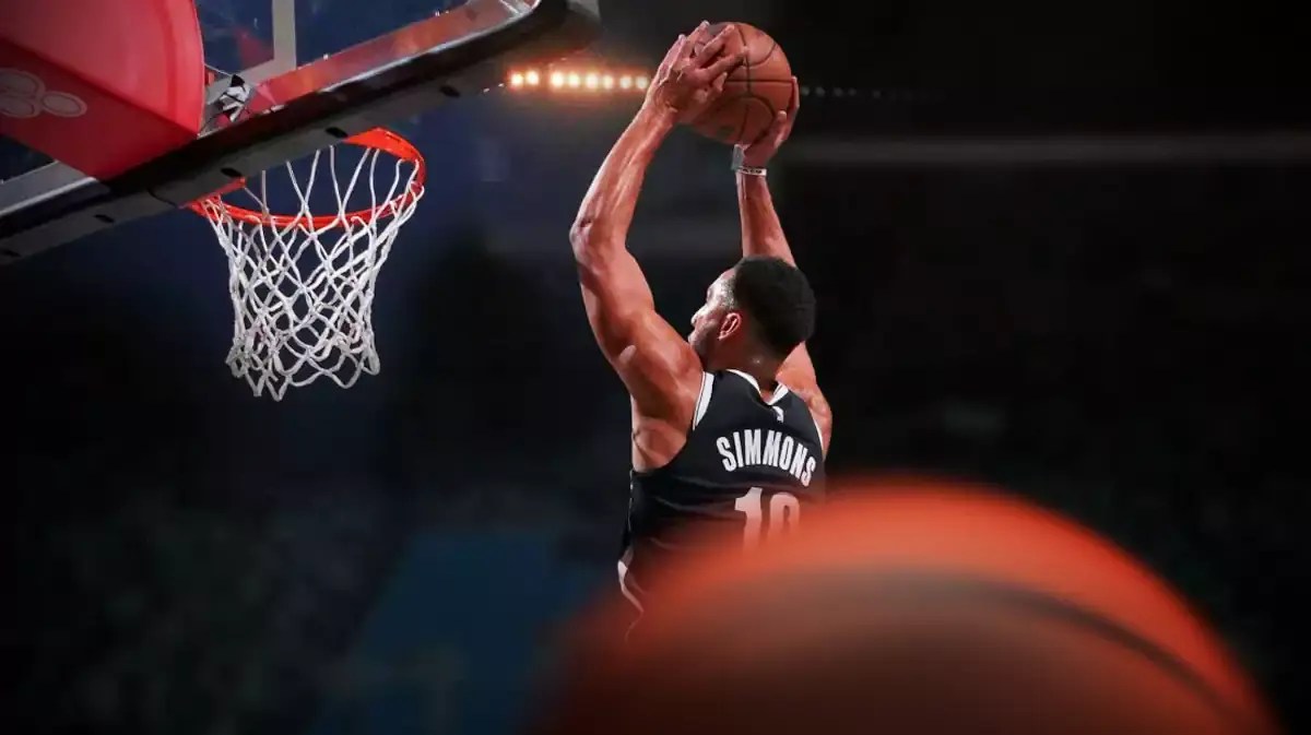 Nets' Ben Simmons dunking a basketball.