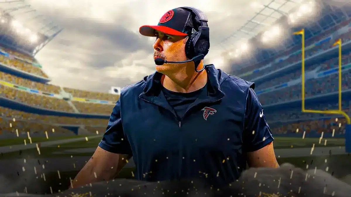 Former Falcons head coach Arthur Smith looking earnestly in front of an NFL stadium