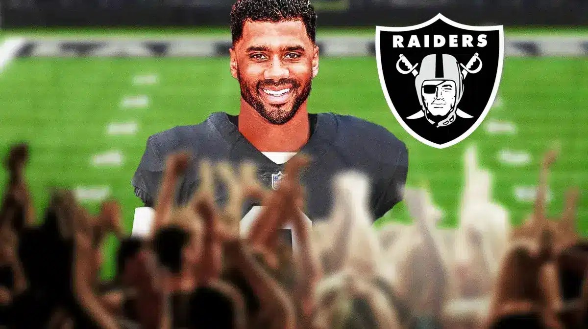 Russell Wilson wearing a Raiders jersey in front of Allegiant Stadium