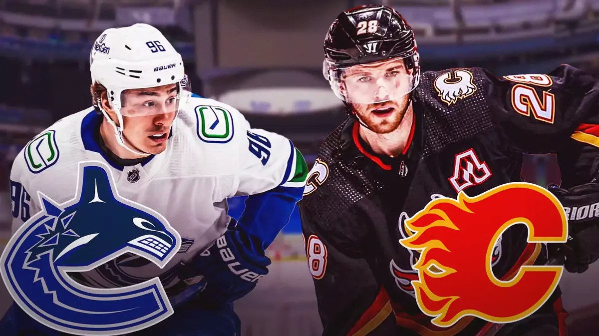 Canucks' Elias Lindholm stands next to Flames' Andrei Kuzmenko after a stunning NHL trade