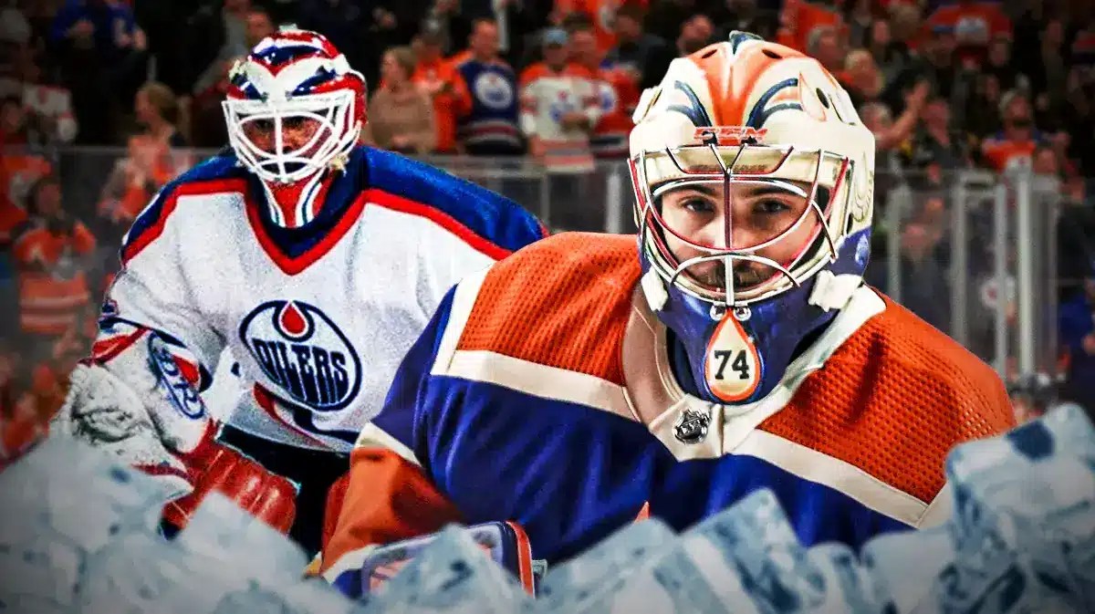Stuart Skinner next to Grant Fuhr, both in Edmonton Oilers jerseys