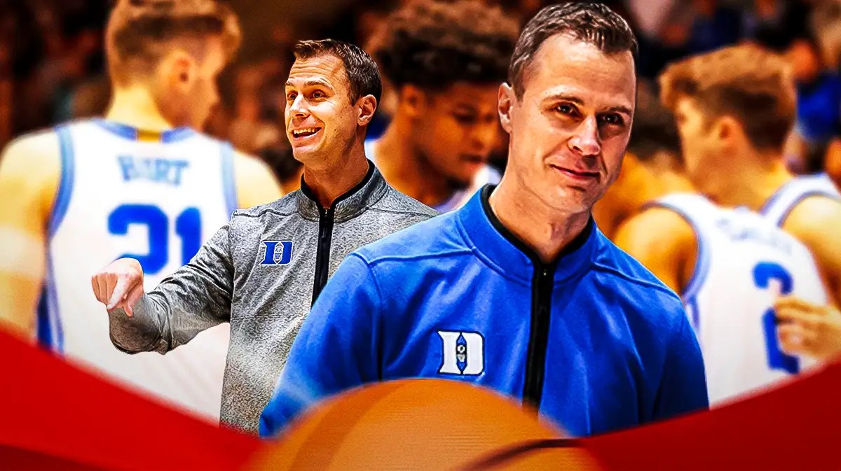 Duke basketball coach Jon Scheyer looking happy.