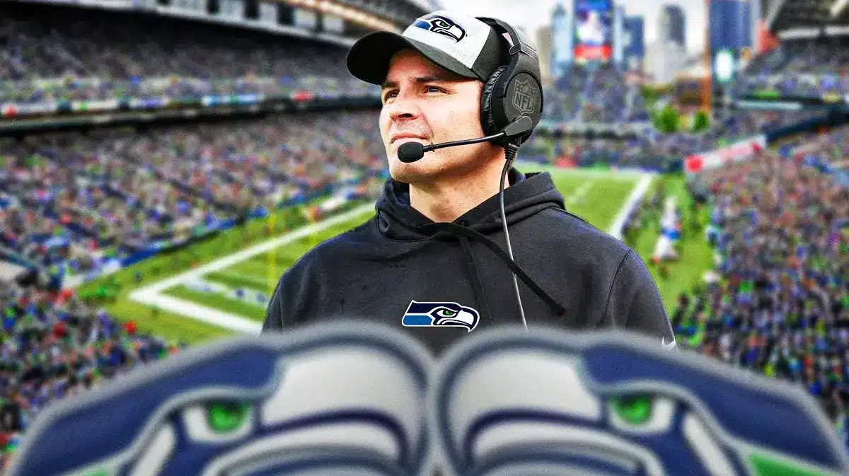 Mike Macdonald in Seahawks shirt if possible and Seahawks stadium in background
