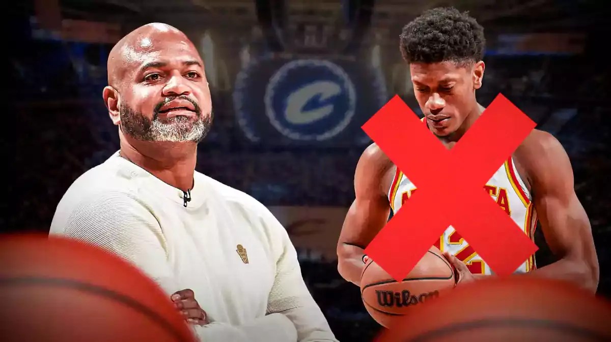 Cavs coach JB Bickerstaff looking at Hawks player De'Andre Hunter.