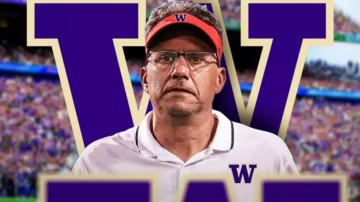 Photo: Jedd Fisch in Washington gear with Washington logo behind him