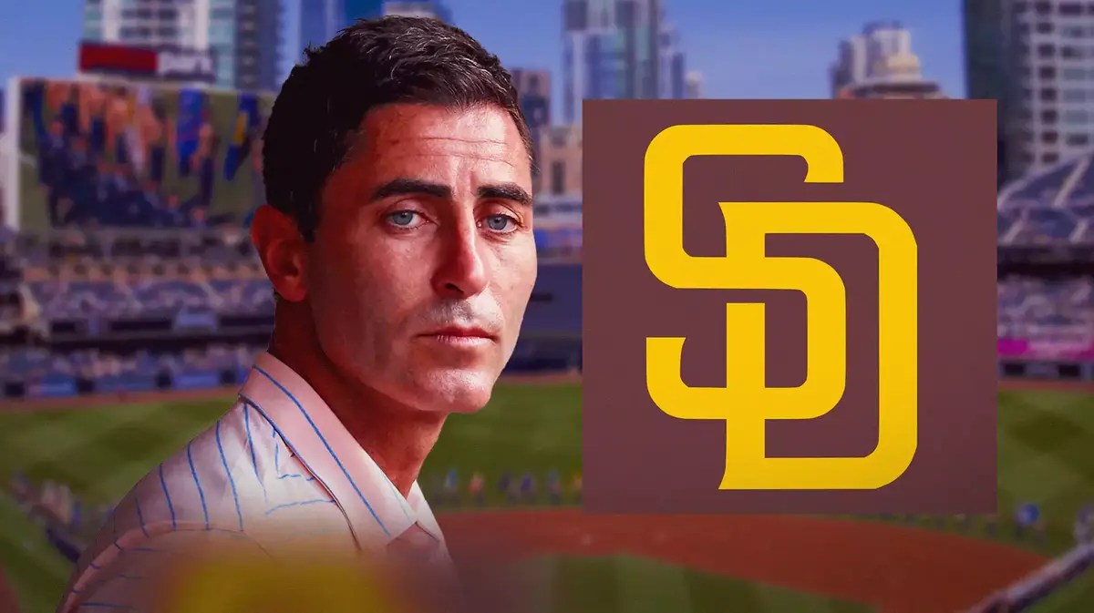 AJ Preller next to a Padres logo at Petco Park