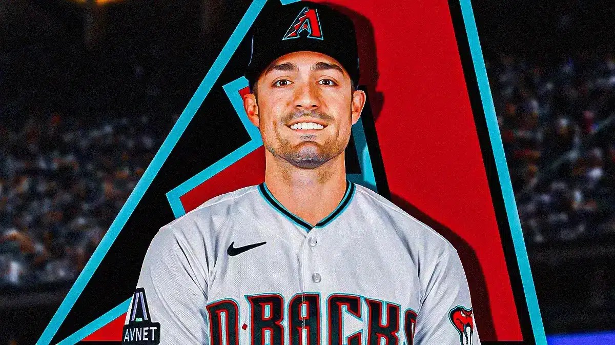 Randal Grichuk in middle of image looking happy in an Arizona Diamondbacks jersey, Diamondbacks logo, baseball field in background