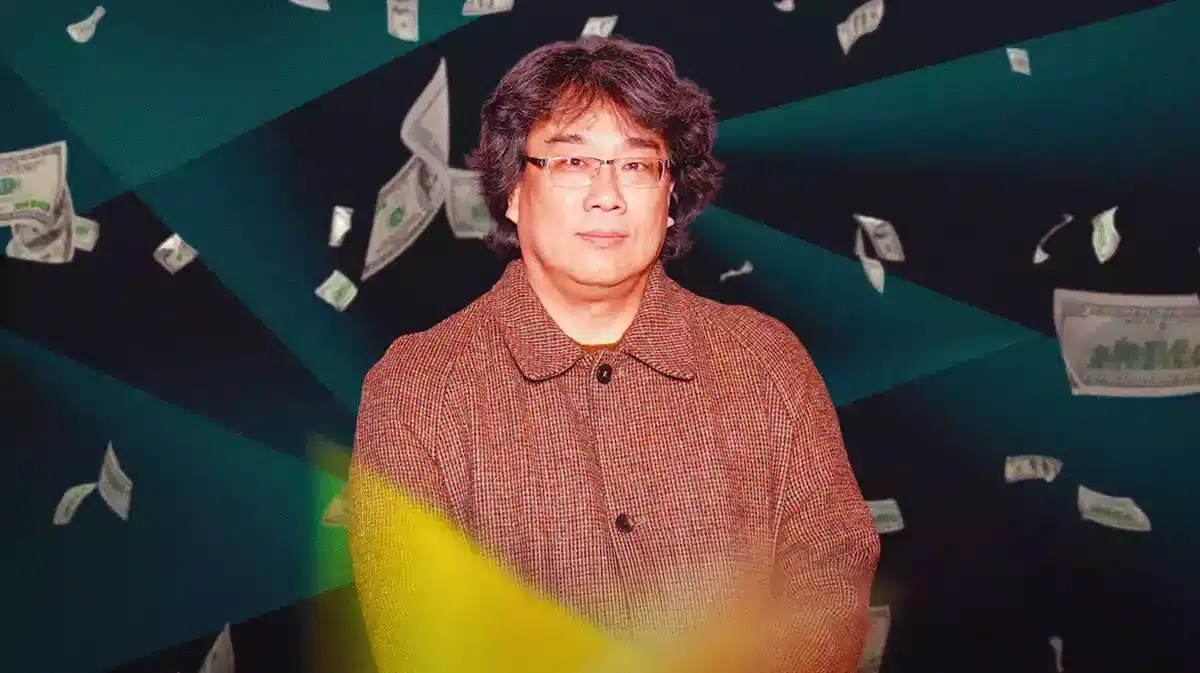 Bong Joon-ho with money falling down around him.