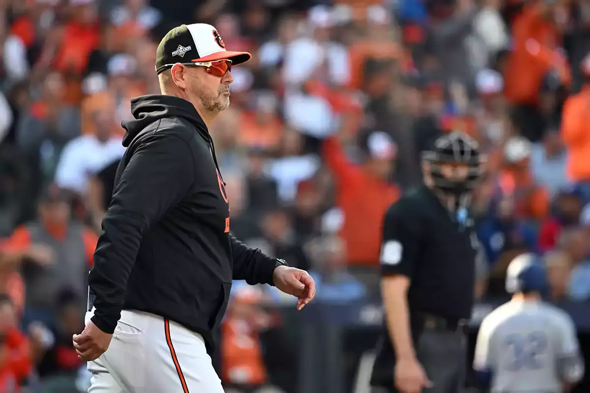 Baltimore Orioles manager Brandon Hyde walks to the mound during the fifth inning against the Texas Rangers in game one of the ALDS for the 2023 MLB playoffs at Oriole Park at Camden Yards.