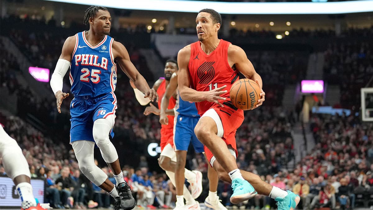  Portland Trail Blazers point guard Malcolm Brogdon (11) drives to the basket against Philadelphia 76ers small forward Danuel House Jr. (25) during the first half at Moda Center