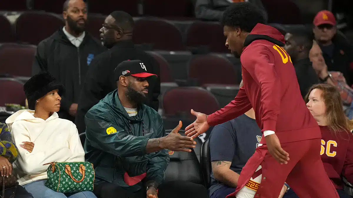 California Trojans guard Bronny James (6) is greeted by father LeBron James during the game against the Washington State Cougars at Galen Center.