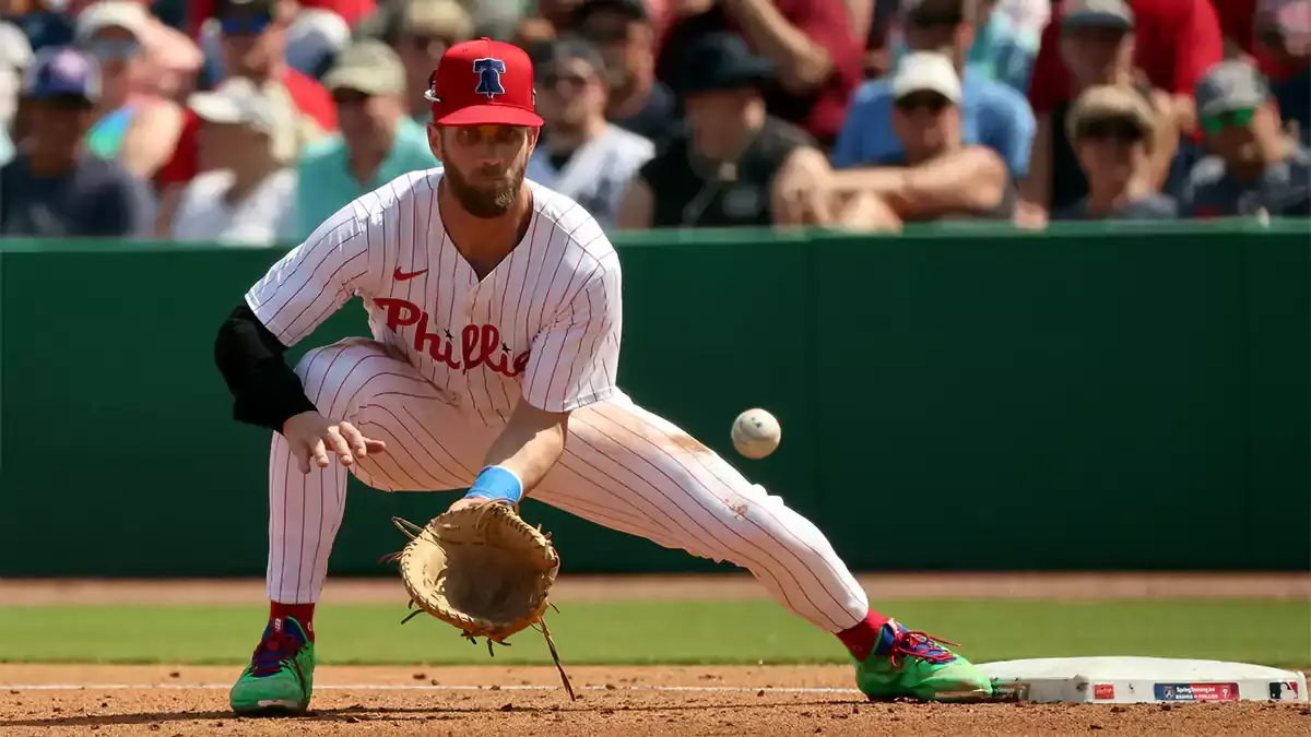 Bryce Harper taking a grounder at first base in spring training for the Philadelphia Phillies