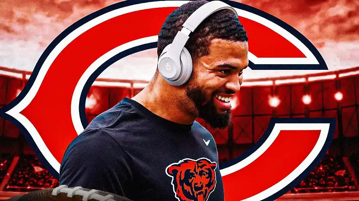 Caleb Williams wearing Bears gear in front of a Bears logo at Soldier Field
