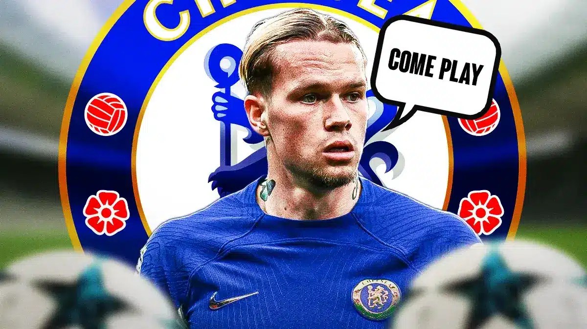 Mykhailo Mudryk saying:'Come play' in front of the Chelsea logo