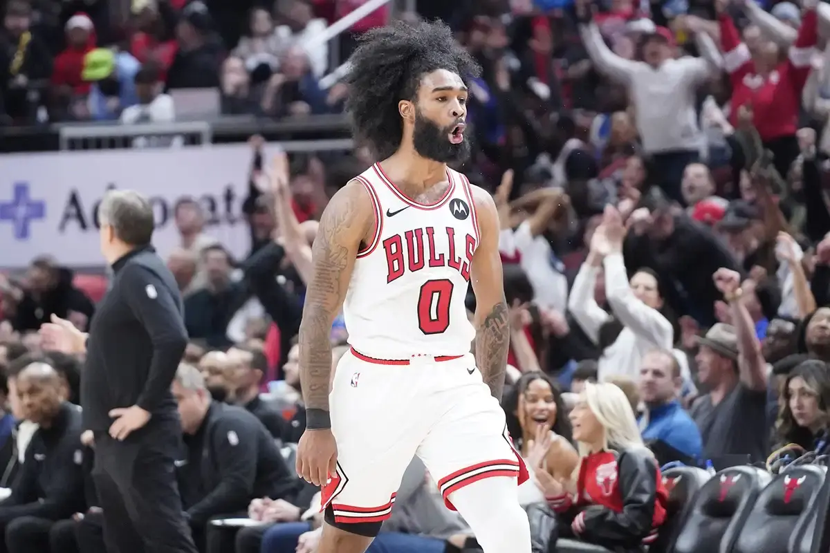 Chicago Bulls guard Coby White (0) reacts after making a three-point basket against the Minnesota Timberwolves during the second half at United Center