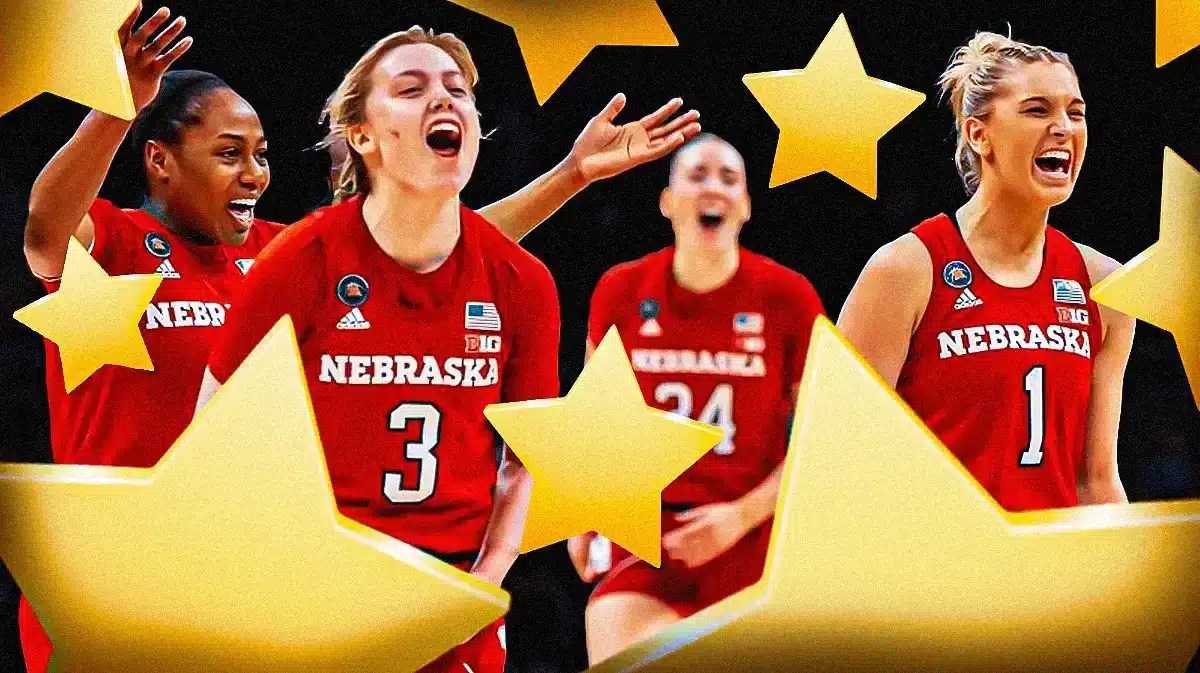 The Nebraska women’s basketball, looking excited, with stars all around them