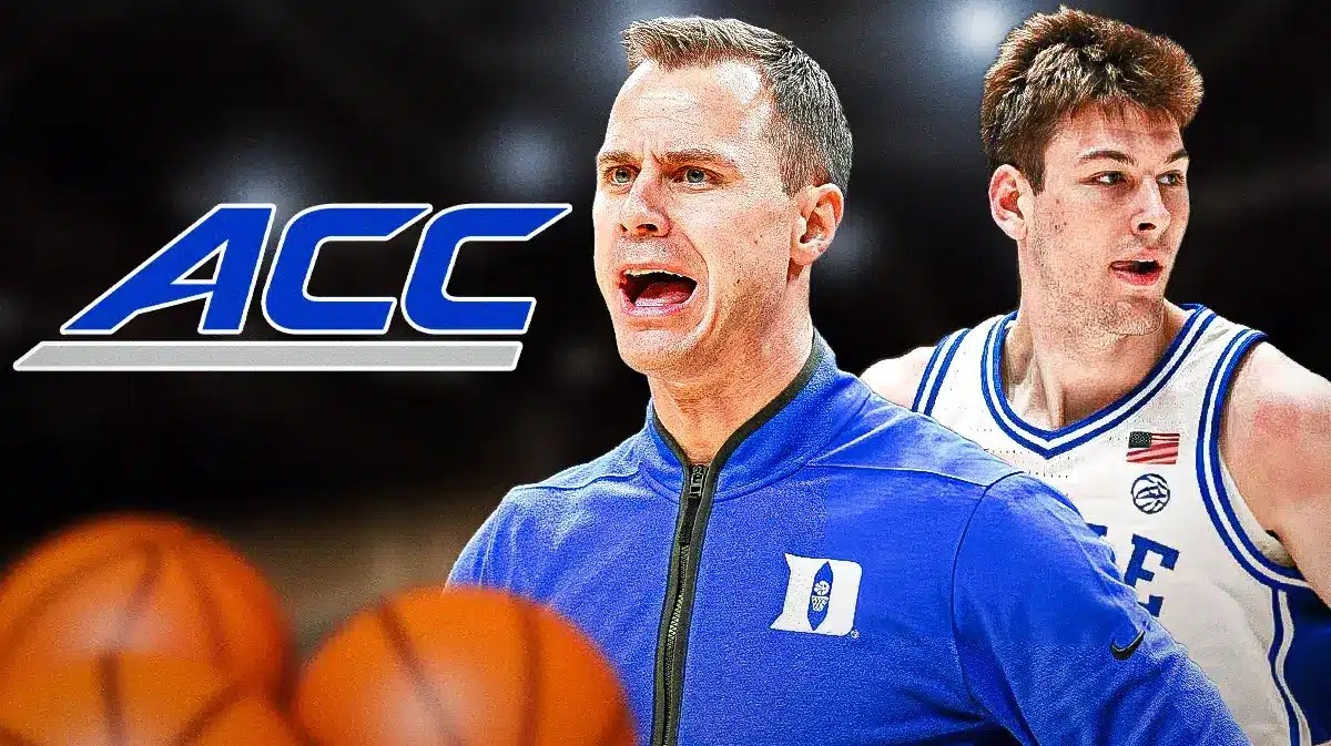 Duke basketball coach Jon Scheyer yelling at an ACC logo with Kyle Filipowski behind him.