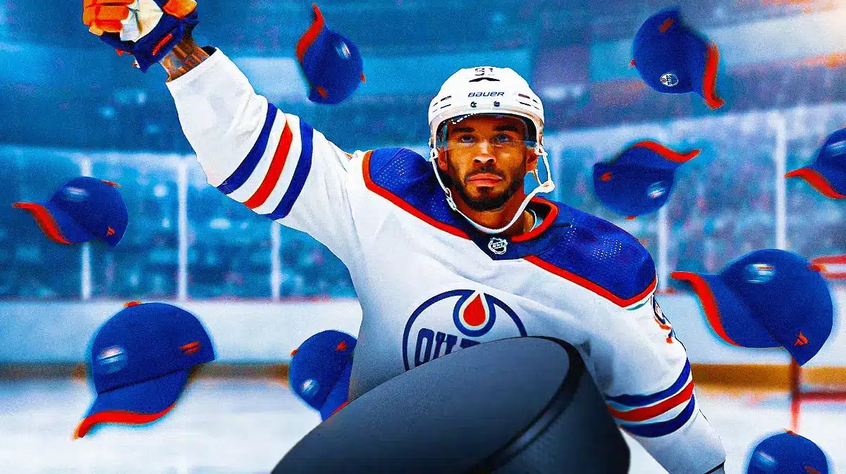 Oilers' Evander Kane waving while hats are thrown around him.