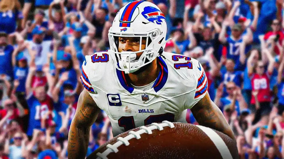 Photo: Gabe Davis in action in Bills jersey with hearts around him, Bills fans in background