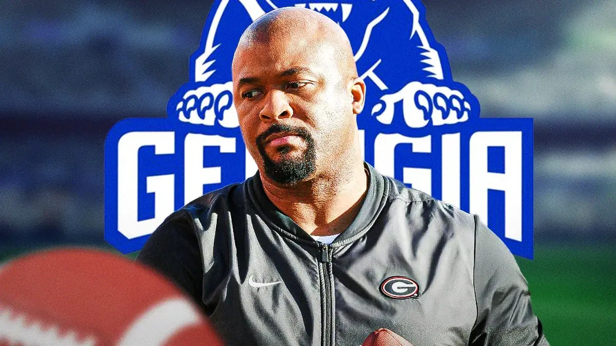 Georgia coach Dell McGee with georgia State logo behind him.