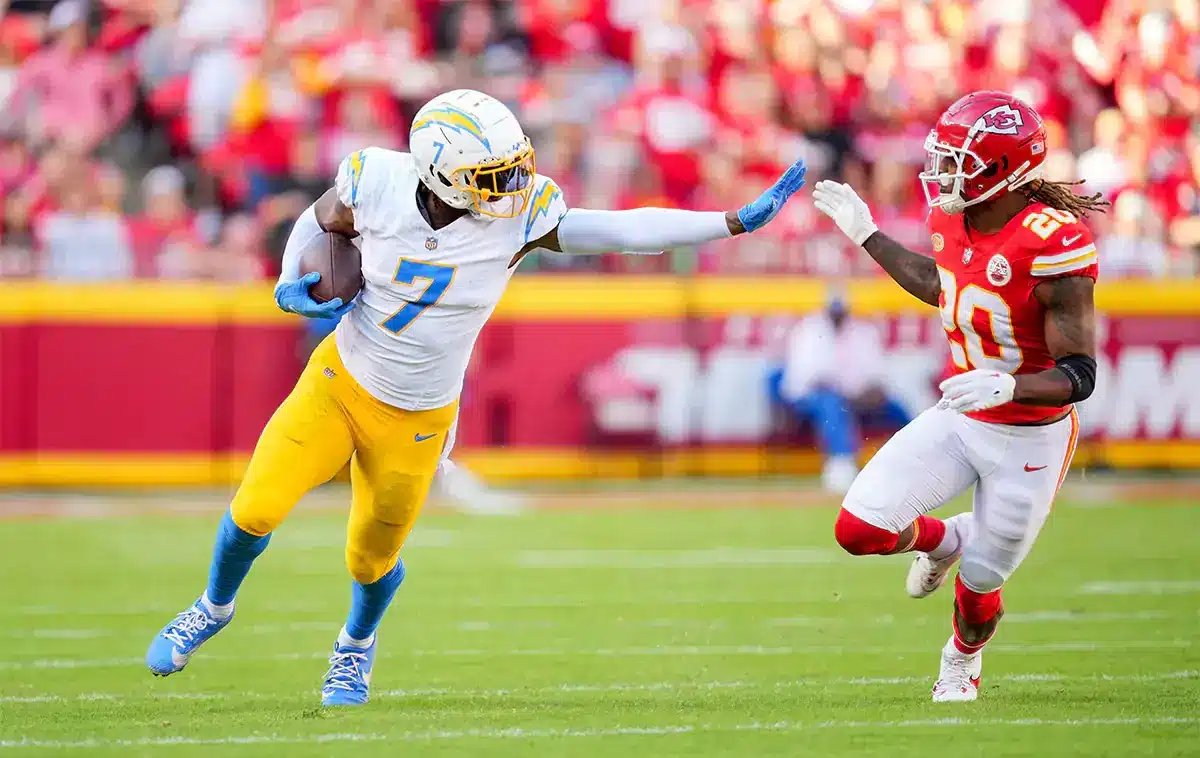 Los Angeles Chargers tight end Gerald Everett (7) runs with the ball against Kansas City Chiefs safety Justin Reid (20) during the first half at GEHA Field at Arrowhead Stadium