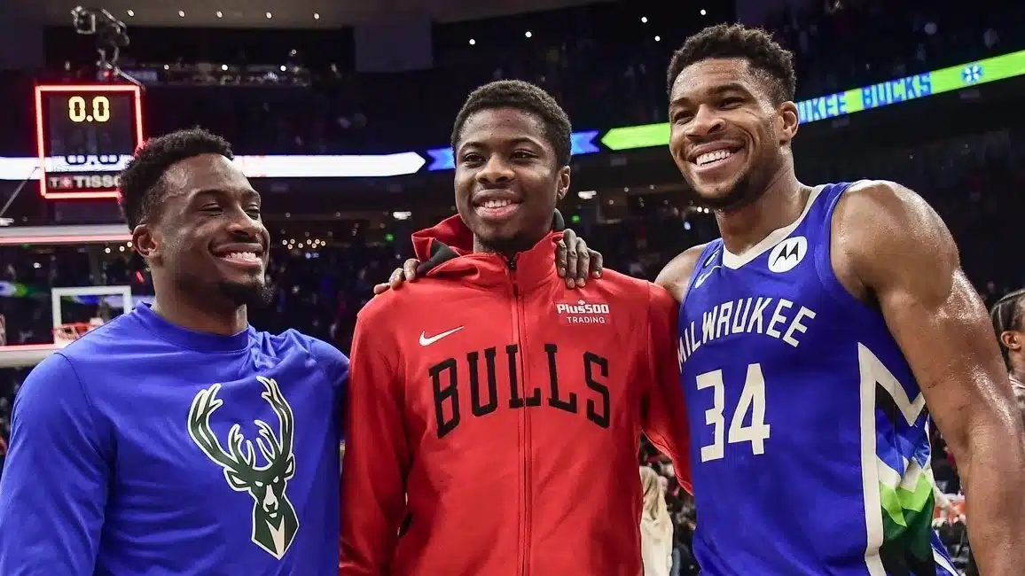 Milwaukee Bucks forward Thanasis Antetokounmpo (43), Chicago Bulls forward Kostas Antetokounmpo (37) and Milwaukee Bucks forward Giannis Antetokounmpo (34) pose for a picture after the game at Fiserv Forum.