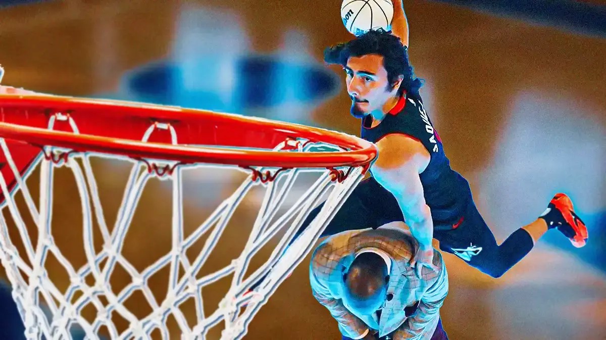 Miami Heat rookie Jaime Jaquez Jr. jumping over Shaquille O'Neal during the Slam Dunk Contest