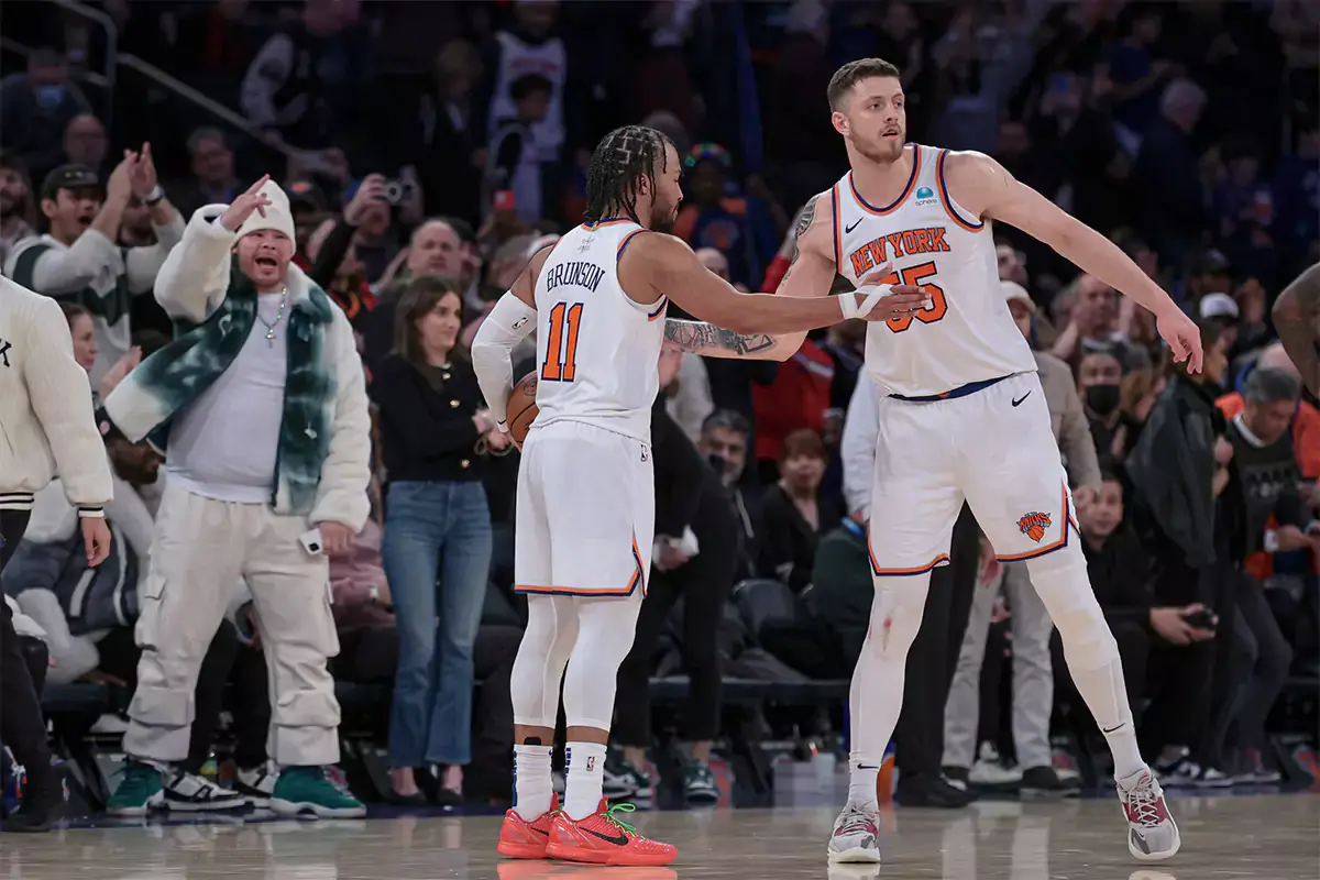 New York Knicks guard Jalen Brunson (11) and center Isaiah Hartenstein (55) celebrates after defeating the Milwaukee Bucks at Madison Square Garden. 