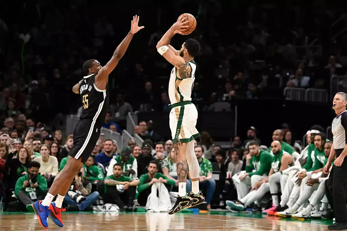 Boston Celtics forward Jayson Tatum (0) shoots the ball over Memphis Grizzlies center Trey Jemison (55) during the second half at TD Garden.